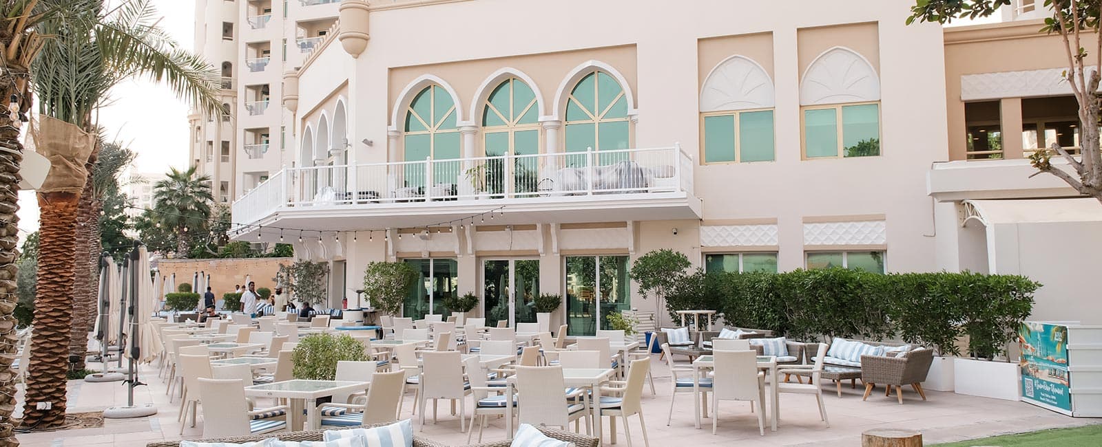 Outdoor terrace and seating at Riva Beach Club