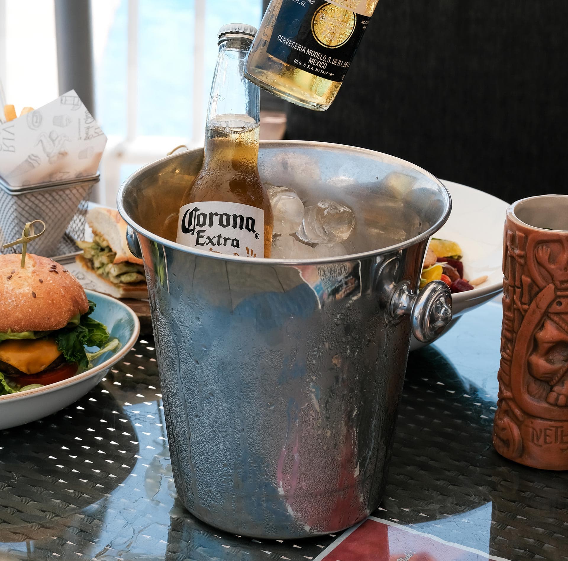 Drinks and dining setup at Riva Beach Club